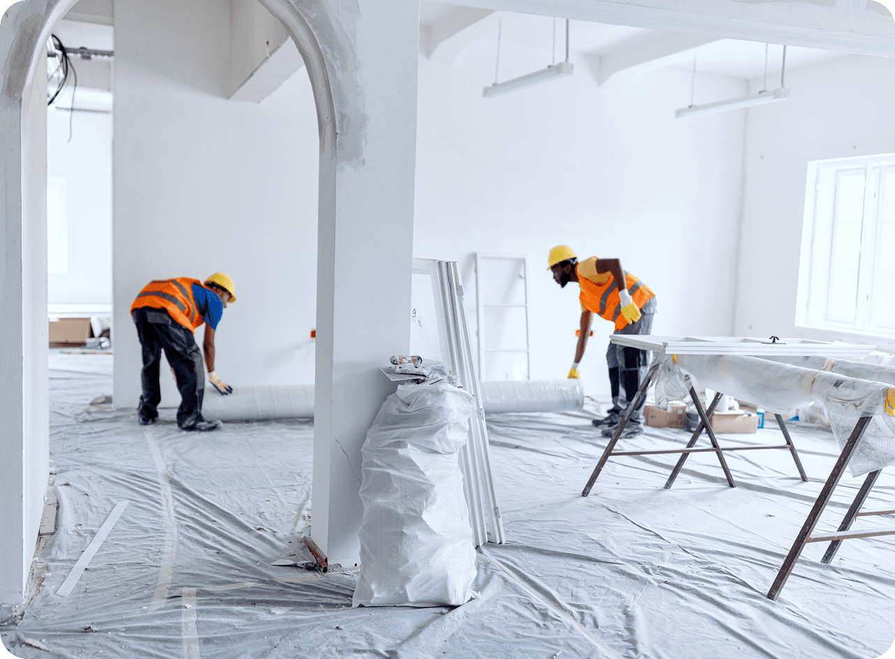 Construction workers renovating a room